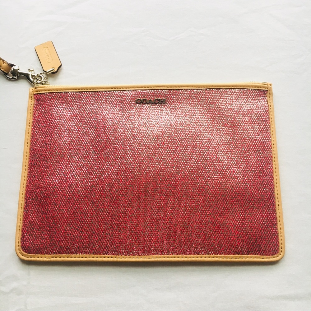 NWT Coach pink shimmer wristlet. Never worn.